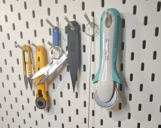 Haak om verschillende soorten naaibenodigdheden op te hangen 